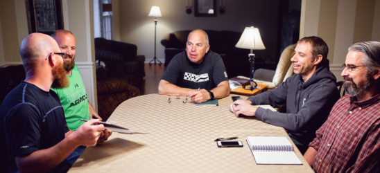 Men meeting around a table